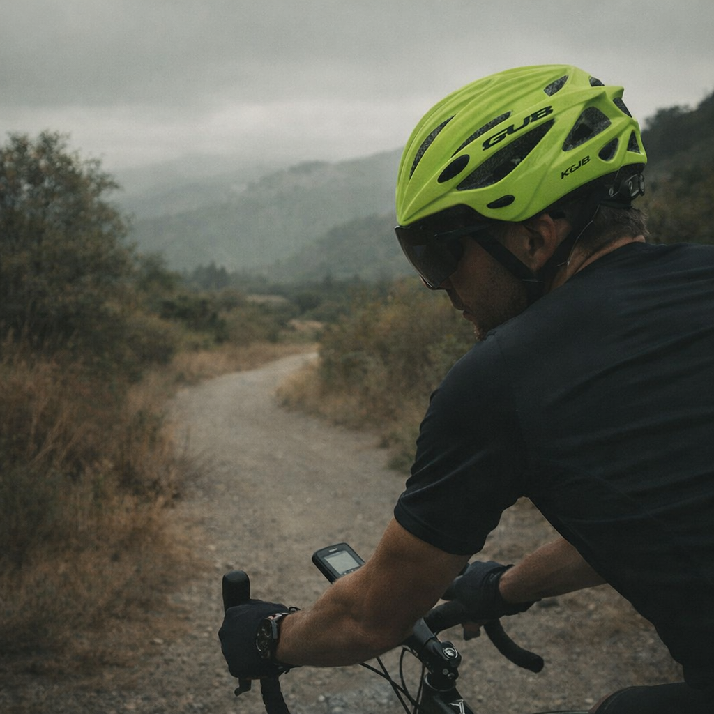 Bicycle helmet with visor and integrated glasses in fluorescent green